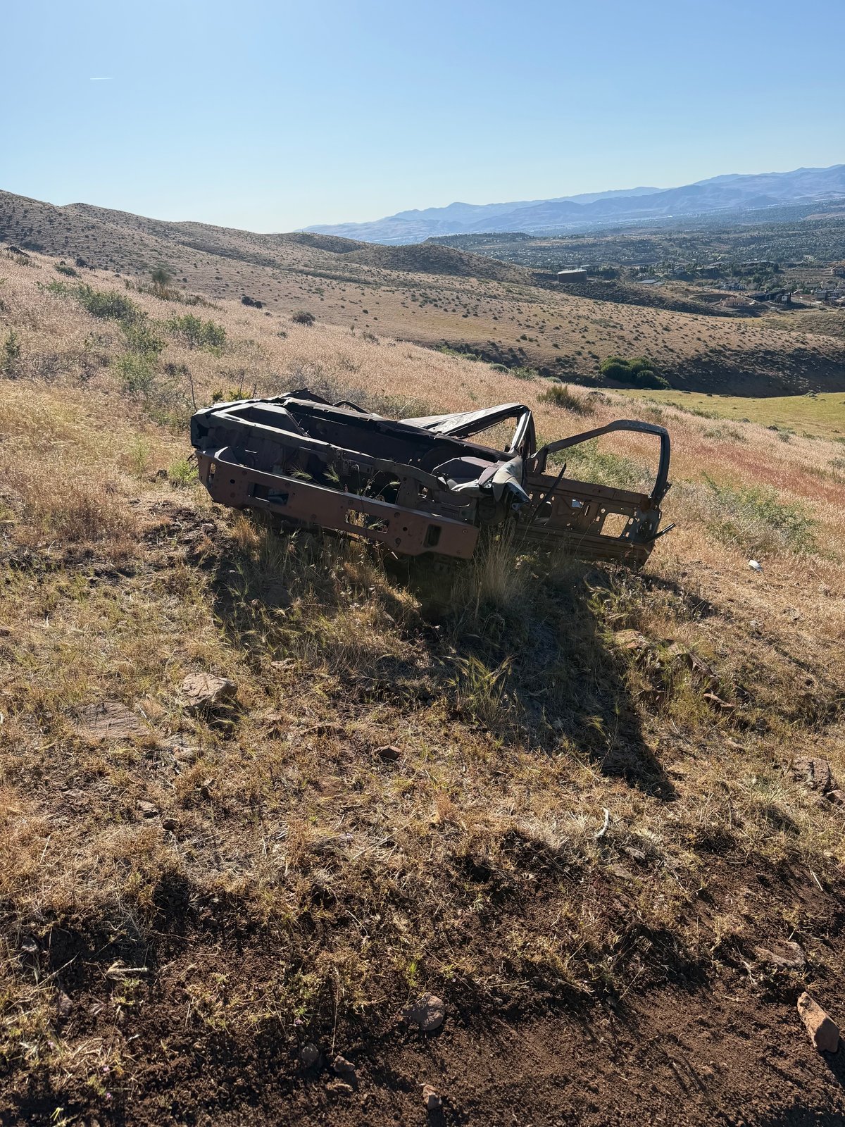 Burned out car on trail